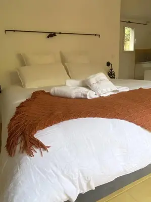 a bedroom with two white towels on a bed at Studio Soléa - Studio 2 - 4 personnes - Domaine Astra, Grans in Grans