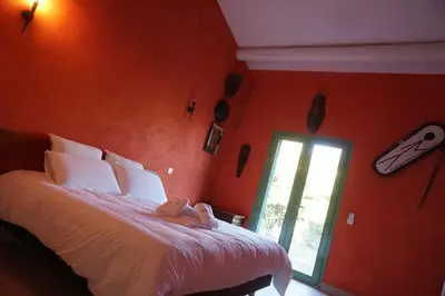 a bedroom with a bed with a teddy bear on it at La Villa Astra de 4 à 12 personnes - Domaine Astra, Grans in Grans