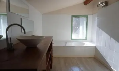 a bathroom with a sink and a bath tub at La Villa Astra de 4 à 12 personnes - Domaine Astra, Grans in Grans