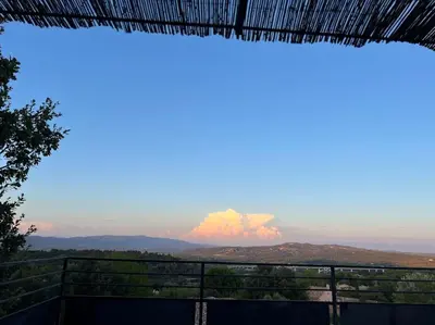 a view of a fire in the distance at L'appart du mas du Zébu Bleu in Vernègues