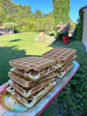 a stack of chocolate waffles on a plate at Au Clair Ventoux B & B - SPA in Saint-Didier