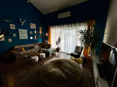 a living room with a couch and a table at Magnifique Duplex à proximité Aix en Provence in Éguilles