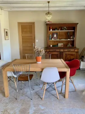 a dining room with a wooden table and chairs at House with swimming pool and breathtaking views of the Luberon in Robion en Luberon