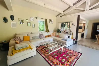a living room with a couch and a table at House with swimming pool and breathtaking views of the Luberon in Robion en Luberon