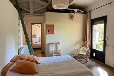 a bedroom with a bed and a room with a window at House with swimming pool and breathtaking views of the Luberon in Robion en Luberon