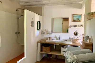 a bathroom with a sink and a mirror at House with swimming pool and breathtaking views of the Luberon in Robion en Luberon