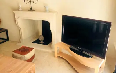a living room with a large flat screen tv at Lovely Home In Le Thor With Wifi in Le Thor