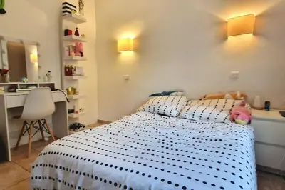 a bedroom with a bed with a stuffed animal on it at Villa Provençale Harmonie 8 Guest poolhouse in Lambesc