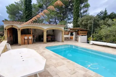 a villa with a swimming pool and a house at Villa Provençale Harmonie 8 Guest poolhouse in Lambesc