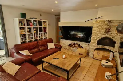 a living room with a couch and a fireplace at Villa Provençale Harmonie 8 Guest poolhouse in Lambesc