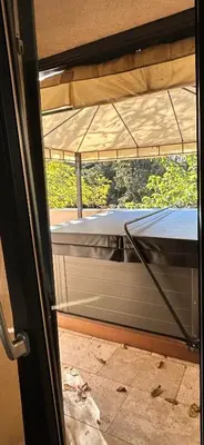 a view of a bed from a window in a room at Logis du Vert Moulin Premium in Le Puy-Sainte-Réparade