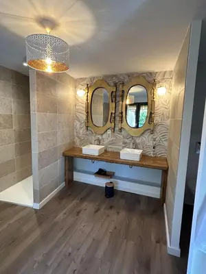 a bathroom with two sinks and two mirrors at Logis du Vert Moulin Premium in Le Puy-Sainte-Réparade
