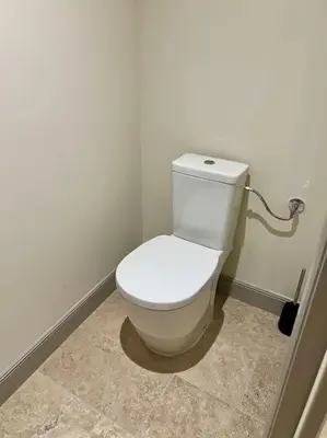 a bathroom with a white toilet in a room at Appartement au coeur du centre historique in Aix-en-Provence