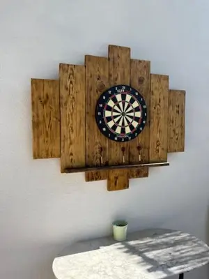 a dart board on a wall with a clock on it at Villa les trois pins in Venelles