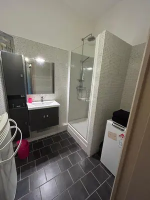a bathroom with a shower and a sink and a tub at Appartement spacieux en Provence in Châteaurenard
