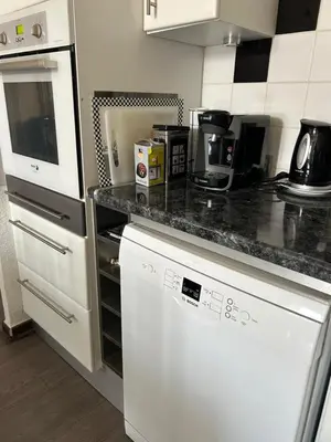 a kitchen with a counter top with a dishwasher at Appartement spacieux en Provence in Châteaurenard