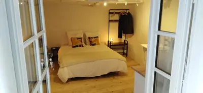 a bedroom with a bed in a room at Les studettes du Beffroi in Cucuron