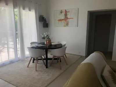 a dining room with a black table and chairs at Holiday Home Provence with Pool in Céreste