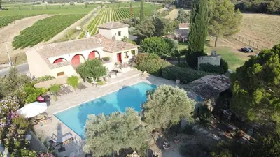 an aerial view of a house with a swimming pool at Moulin AURELIA - chambre La Coloniale in Pélissanne