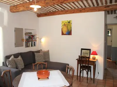 a living room with a couch and a table at Holiday Home in Lacoste with Pool in Lacoste
