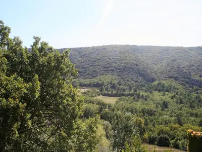a view of a valley with trees and mountains at Holiday Home in Lacoste with Pool in Lacoste