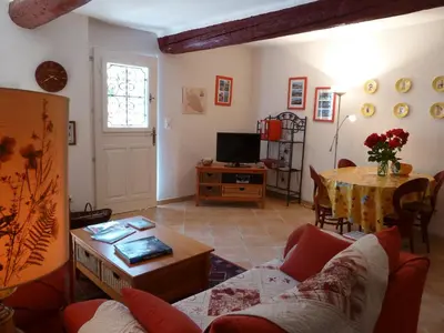 a living room with a couch and a table at La Calvinette in Pernes-les-Fontaines