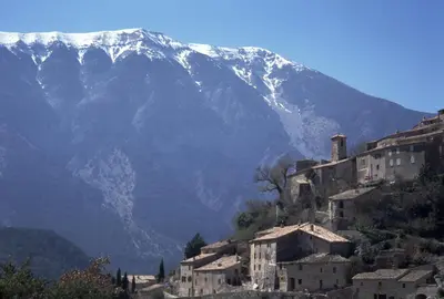 a mountain with snow capped mountains in the background at La Calvinette in Pernes-les-Fontaines