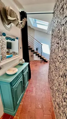 a room with a green counter and a staircase at artist plein centre ville historique in Aix-en-Provence
