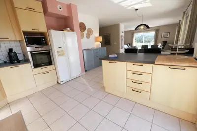 a kitchen with a refrigerator and a counter top at villa avec piscine aureille alpilles paragi ls1-449 in Aureille