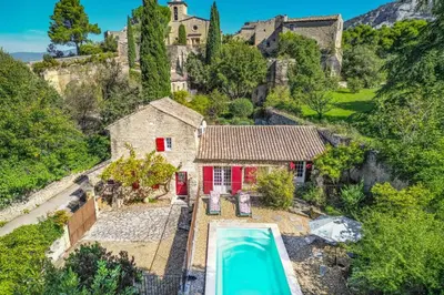 an aerial view of a house with a swimming pool at Villa Le Bastidon by Villa Plus in Les Taillades