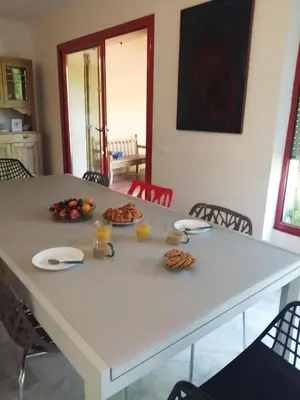 a white table with plates of food on it at #Villa Théo# Grande villa avec piscine in Apt