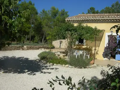 a house with a garden in front of it at Location avec piscine Roussillon LS2-91 in Roussillon