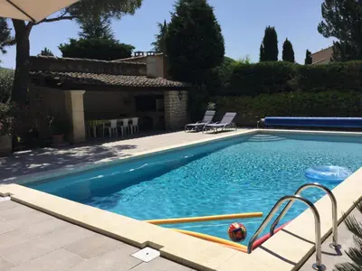 a swimming pool in front of a house at Maison avec piscine privative Taillades Luberon LS2-281 in Les Taillades