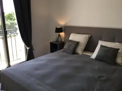a bedroom with a bed with pillows and a window at Villa avec piscine privative Saint Remy de Provence LS1-340 in Saint-Rémy-de-Provence