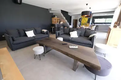 a living room with a couch and a table at Villa avec piscine privative Saint Remy de Provence LS1-340 in Saint-Rémy-de-Provence