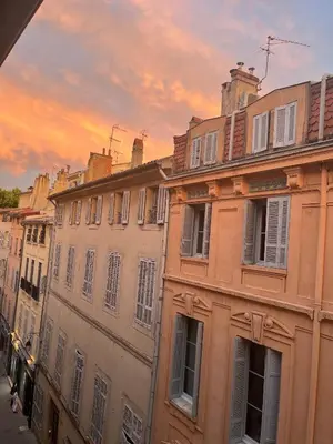 a group of buildings on a street at sunset at T2 lumineux hyper centre Aix en Provence à quelques metres du Cours Mirabeau pour 1 à 5 personnes in Aix-en-Provence