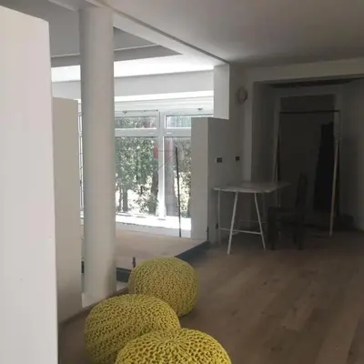 a room with a table and some yellow spheres at Maison spacieuse avec piscine à Aix-en-Provence in Aix-en-Provence