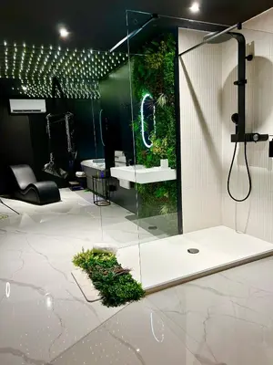 a bathroom with a glass shower with a plant at BDSM TANTRA Love Room Salon-de-Provence in Salon-de-Provence