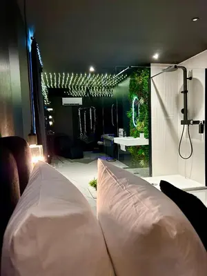a room with a large white pillow in a room with lights at BDSM TANTRA Love Room Salon-de-Provence in Salon-de-Provence