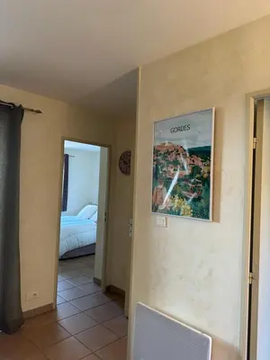 a hotel room with a poster on the wall at Bastidon de Gordes in Gordes