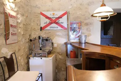 a room with a sewing machine and a table and a counter at Authentique mas avec vue et piscine Eygalieres LS1-447 in Eygalières
