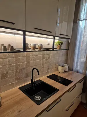 a kitchen with a sink and a counter top at Appartement Cosy Hyper Centre Climatisé - Rue Bédarrides in Aix-en-Provence
