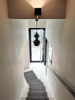 a hallway with a staircase with a black ceiling at Hôtel Bellegarde by Viktor in Aix-en-Provence