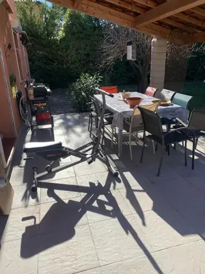 a patio with a table and chairs on a patio at Villa Provençale climatisée près Aix en Provence Piscine securisée alarme in Ventabren