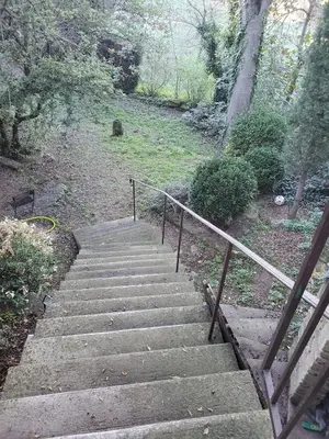 a set of stairs leading up to a stair case at La bonne adresse de Provence in Cornillon-Confoux