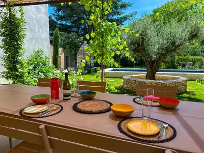 a table with plates of food on top of it at La Magnanerie 1818 villa de prestige 5 étoiles Luberon in Saint-Saturnin-les-Apt