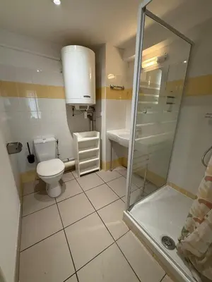a bathroom with a toilet and a sink and a shower at Le Clos d'Aix studio 105 parking in Aix-en-Provence