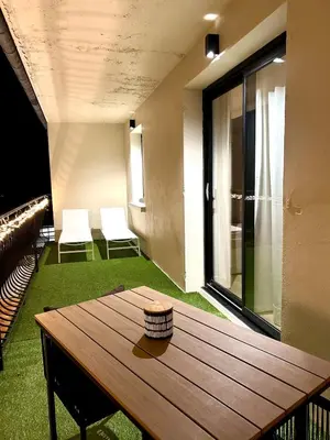 a swimming pool in front of a house at night at Appart 'COSY avec Piscine Chauffée Privée in Salon-de-Provence
