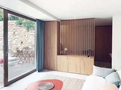 a house with a table and chairs next to a pool at Studio with garden and pool in Aix-en-Provence
