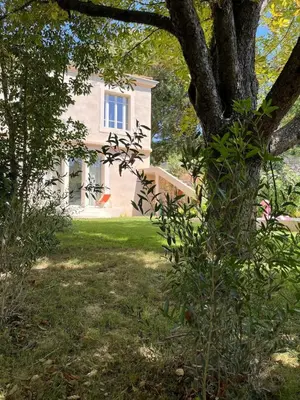 a room with a wooden partition with a vase on a desk at Studio with garden and pool in Aix-en-Provence